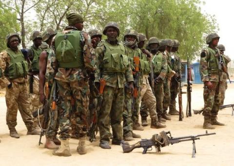 Soldiers stand during a parade in Baga village on the outskirts of Maiduguri, in the north-eastern state of Borno, May 13, 2013. PHOTO BY REUTERS/Tim Cocks