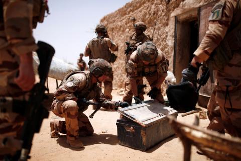 French soldiers of the 2nd Foreign Engineer Regiment search a metal case during an area control operation in the Gourma region during Operation Barkhane in Ndaki, Mali, July 27, 2019. PHOTO BY REUTERS/Benoit Tessier