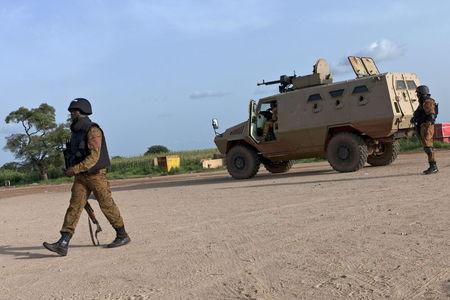 Soldiers guard positions near the Naaba Koom military base in Ouagadougou, Burkina Faso, September 29, 2015. PHOTO BY REUTERS/Arnaud Brunet