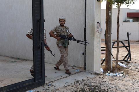 Members of Libya's internationally recognized government forces carry weapons in Ain Zara, Tripoli, Libya, October 14, 2019. PHOTO BY REUTERS/Ismail Zitouny