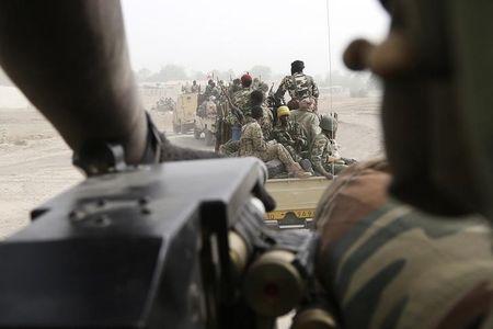 Chadian soldiers drive near the front line during battle against insurgent group Boko Haram in Gambaru, February 26, 2015. PHOTO BY REUTERS/Emmanuel Braun