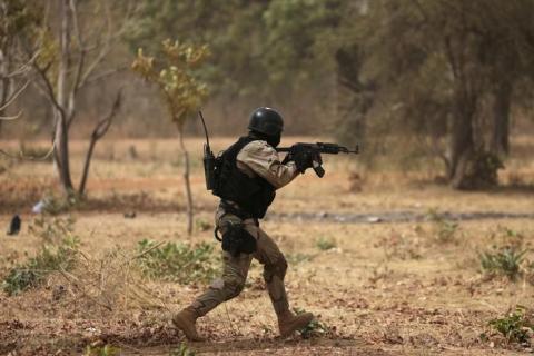 A soldier from Burkina Faso participates in a simulated raid during the U.S. sponsored Flintlock exercises in Ouagadougou, Burkina Faso, February 24, 2019. 2019. PHOTO BY REUTERS/LucGnago