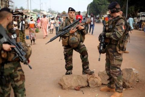 French peacekeeping soldiers patrol a street of the mostly muslim neighbourhood of PK 5 in Bangui, Central African Republic, November 25, 2015. PHOTO BY REUTERS/Siegfried Modola