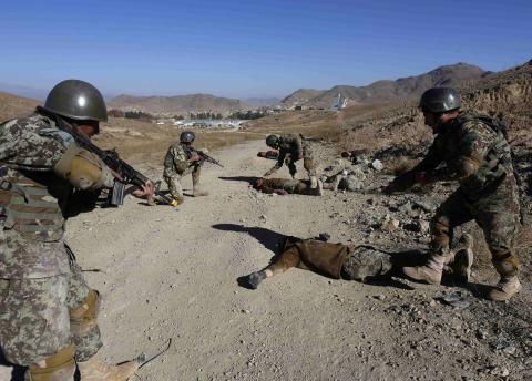 Afghan National Army (ANA) soldiers take part in a training exercise at a military base in Kabul, November 23, 2014. PHOTO BY REUTERS/Omar Sobhani