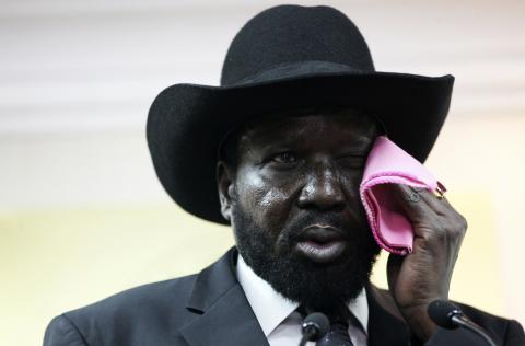 South Sudan's President Salva Kiir wipes his face as he addresses a news conference regarding floods in six of its 10 states which have displaced thousands