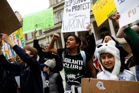 Students hold banners and placards during a demonstration against climate change in New York, U.S., March 15, 2019. PHOTO BY REUTERS/Shannon Stapleton