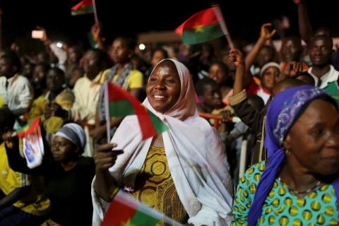 Supporters of President-elect Roch Marc Kabore cheer at Kabore's campaign headquarters in Ouagadougou, December 1, 2015. PHOTO BY REUTERS/Joe Penney