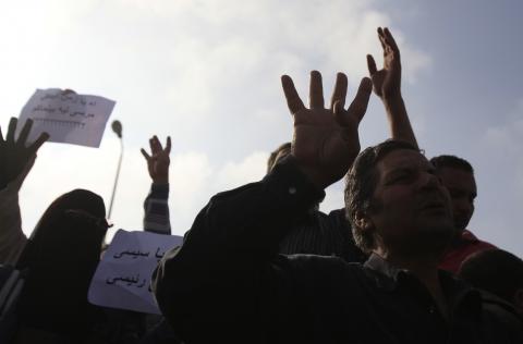 Supporters of the Muslim Brotherhood and ousted Egyptian President Mohamed Mursi shout slogans against the military and interior ministry