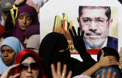 Supporters of the Muslim Brotherhood and ousted Egyptian President Mohamed Mursi take part in a protest against the military and interior ministry