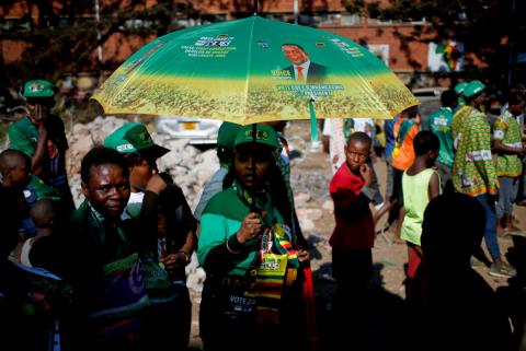 Supporters of President Emmerson Mnangagwa's ruling ZANU-PF party gather to celebrate his election victory in Harare, Zimbabwe, August 3, 2018. PHOTO BY REUTERS/Siphiwe Sibeko