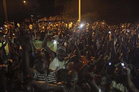 Anti-coup protesters sing the national anthem in front of the residence of the traditional leader Mogho Naaba in Ouagadougou, Burkina Faso, September 21, 2015. PHOTO BY REUTERS/Joe Penney