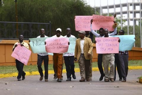 Supporters celebrate after Uganda's President Yoweri Museveni signed a law imposing harsh penalties for homosexuality in Kampala