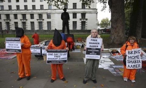 Supporters of Shaker Aamer, the last British prisoner at Guantanamo Bay, demonstrate outside Downing street in central London, October 24, 2015. PHOTO BY REUTERS/Paul Hackett