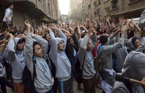 Supporters of Islamist President Mohamed Mursi, who was overthrown by the army after demonstrations against his rule last July, shout slogans during a protest in Omranya area, south of Cairo