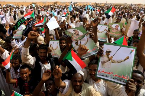 Supporters of Lieutenant General Mohamed Hamdan Dagalo, deputy head of the military council and head of paramilitary Rapid Support Forces (RSF), cheer as he arrives at a meeting in Aprag village, 60 kilometers from Khartoum, Sudan, June 22, 2019. PHOTO BY REUTERS/Umit Bektas