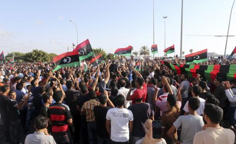 People attend a rally in support of former Libyan army officer Khalifa Haftar, in Benghazi