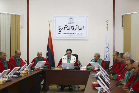 President of Libya's Supreme Court Kamal Edhan (C) chairs a hearing to discuss the legitimacy of Prime Minister Ahmed Maiteeq in Tripoli