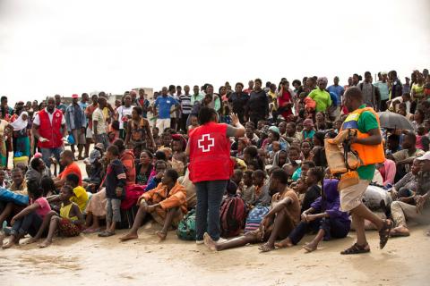 Survivors of Cyclone Idai, listen to a volunteer from Mozambique Red Cross, after arriving to an evacuation centre in Beira, Mozambique, March 21, 2019. PHOTO BY REUTERS/Denis Onyodi/Red Cross Red Crescent Climate Centre