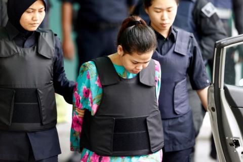 Vietnamese Doan Thi Huong, who is on trial for the killing of Kim Jong Nam, the estranged half-brother of North Korea's leader, is escorted as she arrives at the Shah Alam High Court on the outskirts of Kuala Lumpur, Malaysia, January 22, 2018. PHOTO BY REUTERS/Lai Seng Sin