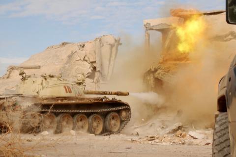 A military vehicle fires as fighters of Libyan forces allied with the U.N.-backed government push into the last area held by Islamic State militants in Ghiza Bahriya district in Sirte, Libya, November 26, 2016. PHOTO BY REUTERS/Hani Amara