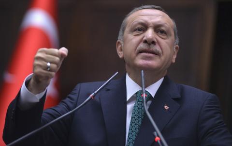 Turkey's Prime Minister Tayyip Erdogan addresses members of parliament from his ruling AK Party (AKP) during a meeting at the Turkish parliament in Ankara