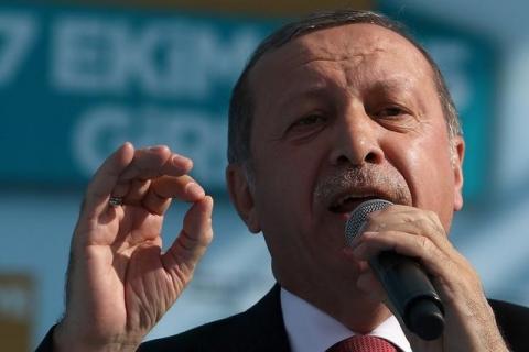 Turkish President Tayyip Erdogan gives a speech during an inauguration ceremony of a water pipeline project linking Turkey to northern Cyprus, in Myrtoy, October 17, 2015. PHOTO BY REUTERS/Yiannis Kourtoglou