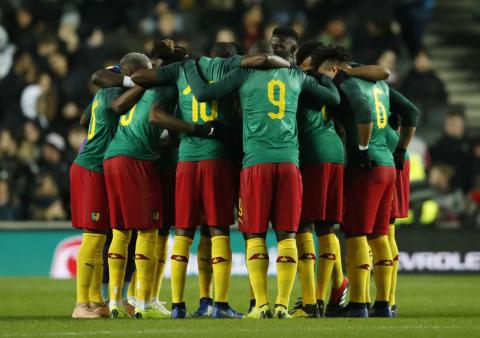 Cameroon team huddle Action. PHOTO BY REUTERS/Andrew Boyers