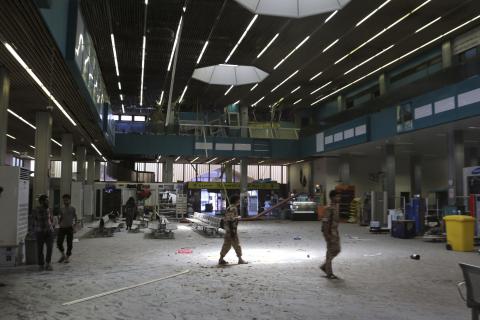 The inside of a damaged terminal is seen after a shelling at Tripoli International Airport