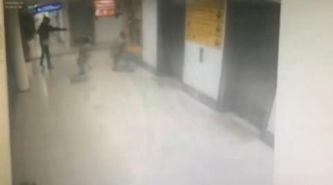 A still image from CCTV footage from Istanbul airport, Turkey released June 30, 2016 shows an attacker shooting a plain clothes police officer at point blank range with a pistol, June 28, 2016. PHOTO BY REUTERS/HABERTURK