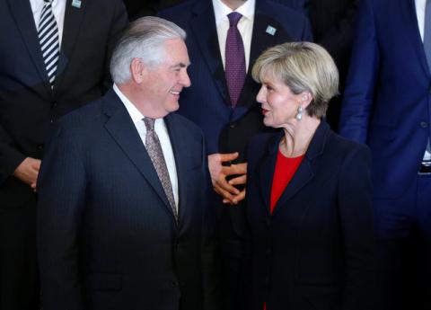 Secretary of State Rex Tillerson and Australian Foreign Minister Julie Bishop speak during the delegation photo with leaders from the Global Coalition - Working to Defeat ISIS at the State Department in Washington, DC, U.S., March 22, 2017. PHOTO BY REUTERS/Joshua Roberts