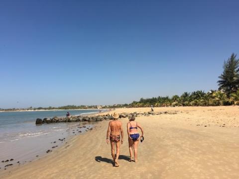 Tourists take a morning stroll along the beach in Saly, a coastal resort town in Senegal popular with Western tourists, March 15, 2016. PHOTO BY REUTERS/Edward McAllister