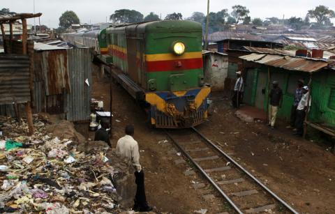 A commuter train on the Kenya-Uganda railway line travels through the sprawling Kibera slum. PHOTO BY REUTERS/Thomas Mukoya