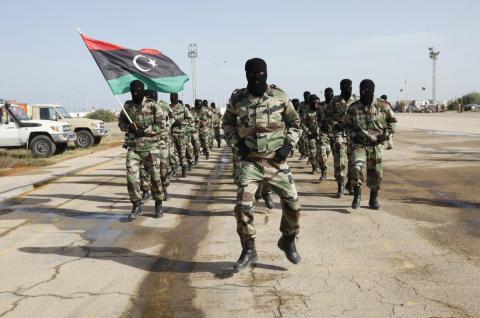 Libyan Army soldiers march during a military graduation parade for trainees in Tripoli, November 12, 2014. PHOTO BY REUTERS/Ismail Zitouny