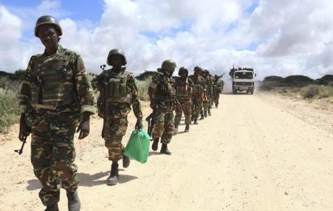 African Union Mission in Somalia (AMISOM) peacekeepers from Burundi patrol after fighting between insurgents and government soldiers on the outskirts of Mogadishu