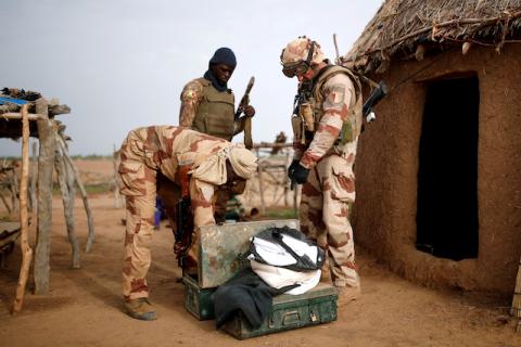 Troops from the Malian Armed Forces (FAMa) and a French soldier conduct a joint patrol in Ndaki, Mali, July 29, 2019. PHOTO BY REUTERS/Benoit Tessier