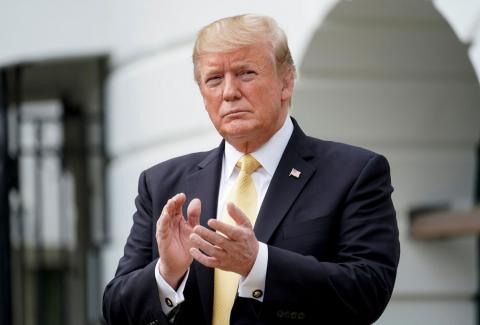 U.S. President Donald Trump applauds during an event honoring 2018 NASCAR Cup Series Champion Joey Logano at the White House in Washington, U.S., April 30, 2019. PHOTO BY REUTERS/Joshua Roberts