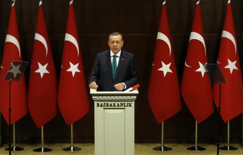 Turkish Prime Minister Tayyip Erdogan addresses the media in Ankara
