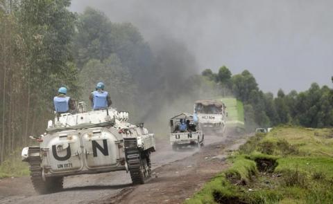 U.N. peacekeepers drive their tank as they patrol past the deserted Kibati village near Goma in the eastern Democratic Republic of Congo. PHOTO BY REUTERS/Thomas Mukoya