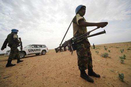 UNAMID peacekeepers stand guard as a delegation of Ambassadors of European Union to Sudan visits a women development program centre funded by World Food Programme (WFP) at Shagra village in North Darfur, October 18, 2012. PHOTO BY REUTERS/Mohamed Nureldin Abdallah