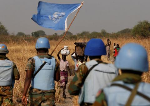 United Nations Mission in South Sudan (UNMISS) peacekeepers meet women and children on their path during a patrol near Bentiu, northern South Sudan, February 11, 2017. PHOTO BY REUTERS/Siegfried Modola