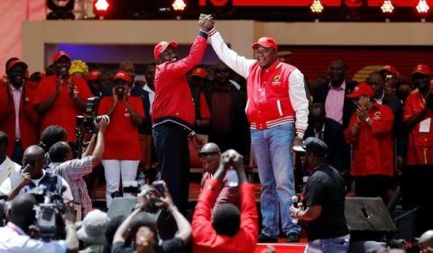 Kenya's President Uhuru Kenyatta (R) and his Deputy William Ruto (L) greet as they salute supporters at the Kasarani stadium during the official launch of the Jubilee Party ahead of the 2017 general elections in Kenya's capital Nairobi, September 10, 2016. PHOTO BY REUTERS/Thomas Mukoya