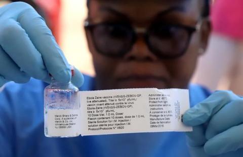 A World Health Organization (WHO) worker prepares to administer a vaccination during the launch of a campaign aimed at beating an outbreak of Ebola in the port city of Mbandaka, Democratic Republic of Congo, May 21, 2018. PHOTO BY REUTERS/Kenny Katombe