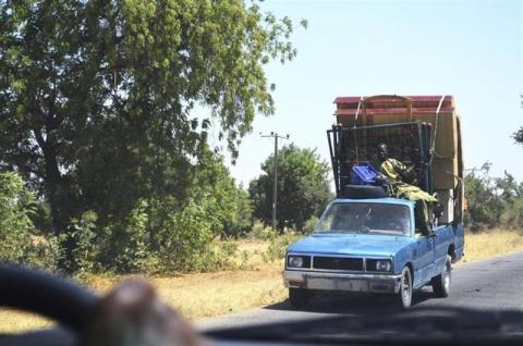 A vehicle, loaded with personal belongings, is seen travelling out of Bama, Borno State, February 20, 2014, after an attack by Boko Haram militants