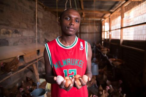 Victor Kyalo holds half a dozen eggs at his small household farm in the outskirts of Nairobi, Kenya, April 18, 2019. PHOTO BY REUTERS/Hereward Holland