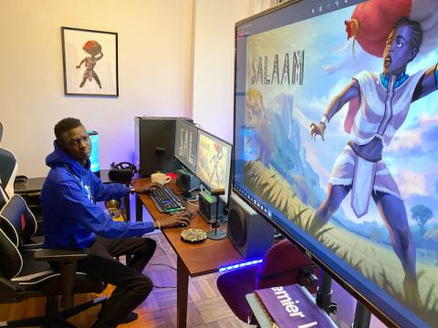 Video game developer Lual Mayen, 25, who learned to code in a refugee camp after fleeing South Sudan, plays his new game at his home in Washington, D.C., U.S., January 7, 2020. PHOTO BY REUTERS/Lucy Nicholson