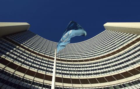 The flag of the International Atomic Energy Agency (IAEA) flies in front of its headquarters during a board of governors meeting in Vienna