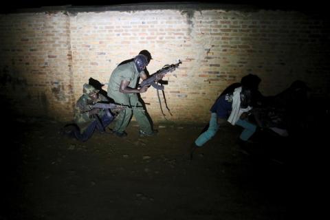 Armed vigilantes patrol in the center of Bujumbura, Burundi, November 20, 2015. PHOTO BY REUTERS/Goran Tomasevic