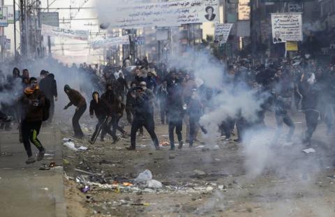 Supporters and opponents of ousted Egyptian President Mohamed Mursi clash at Nasr City district in Cairo