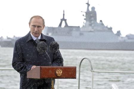 Russian President Vladimir Putin delivers a speech during celebrations for Navy Day as it rains in Baltiysk, Kaliningrad region, Russia, July 26, 2015. REUTERS/RIA Novosti/Mikhail Klimentyev/Kremlin