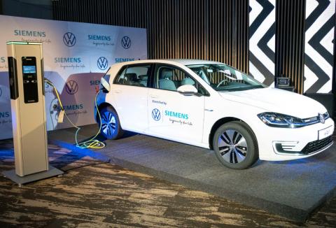 A Volkswagen e-Golf electric car is seen charging during its launch for use in its ride-hailing service in Kigali, Rwanda, October 29, 2019. PHOTO BY REUTERS/Jean Bizimana